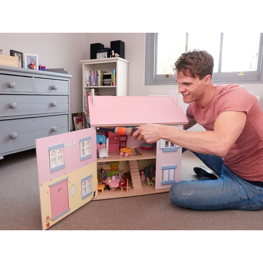 BLACKDECKER BCF602C cordless screwdriver used on pink dollhouse in children's room photography