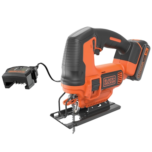 A BLACK+DECKER cordless jigsaw with a lithium-ion battery and attached charger. The tool is orange and black, with the battery piece visible at the rear and the blade at the front.