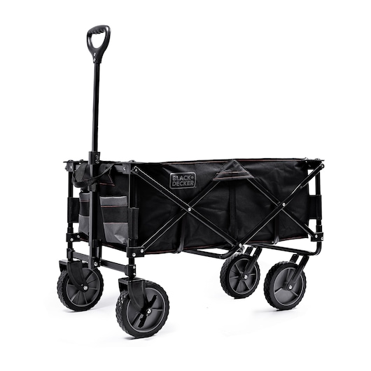 A BLACK+DECKER collapsible utility wagon with a sturdy black frame, large wheels, a telescoping handle, and fabric storage compartments on the side.