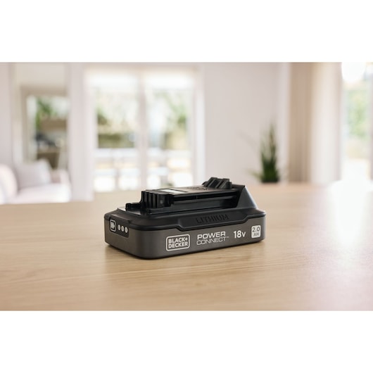 BLACKDECKER BDL2018S lithium 18V 2.0Ah Power Connect battery pack on wooden table, side angle.