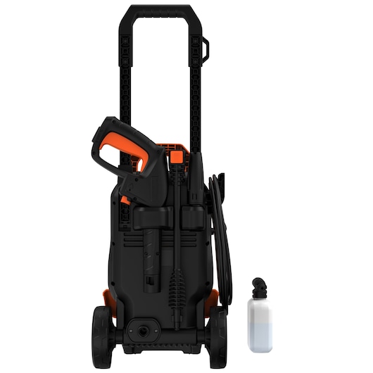 A BLACK+DECKER BEPW1700 pressure washer with a black and orange design, shown from the front. The washer features a spray gun, hose, and wheels for portability, with an additional detergent bottle placed next to it.