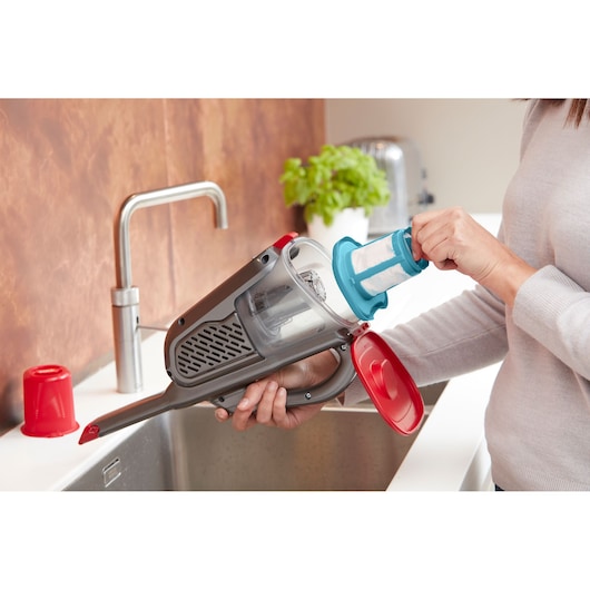 BLACKDECKER BHHV315J handheld vacuum filter removal in kitchen setting.