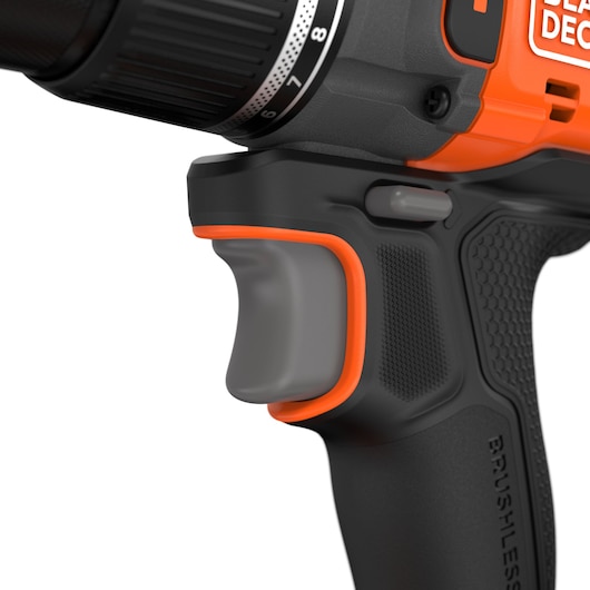 BLACKDECKER BLD783N close-up of cordless drill handle and trigger, black and orange, white background.