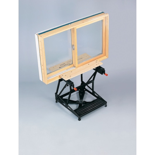 BLACKDECKER WM536 workbench side angle with wooden window frame clamped onto the surface.